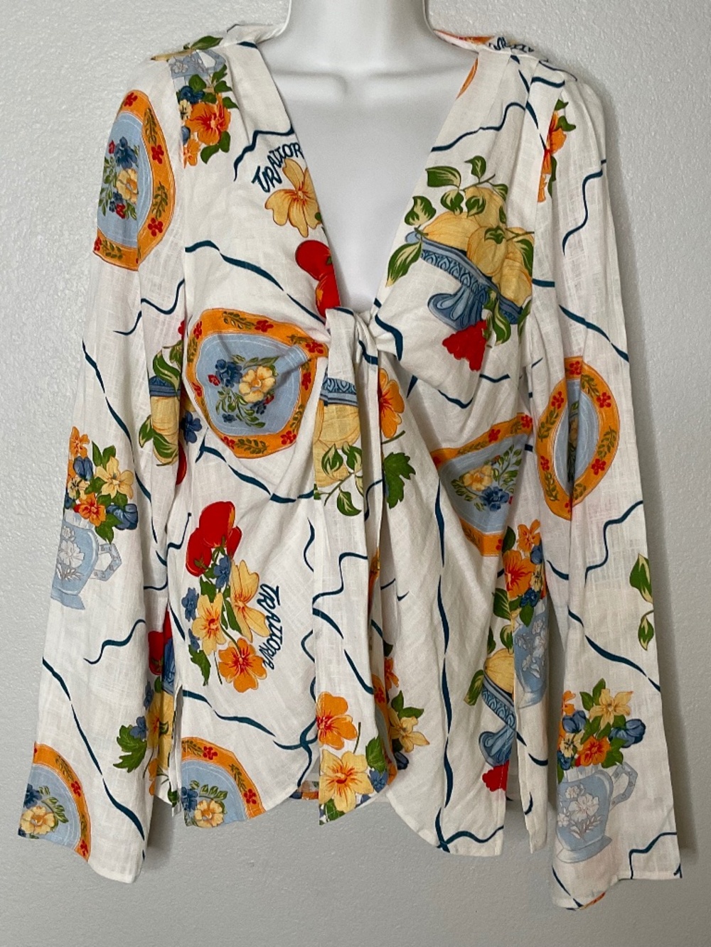 Sabo Alessia top featuring a white Trattoria print and a front tie closure